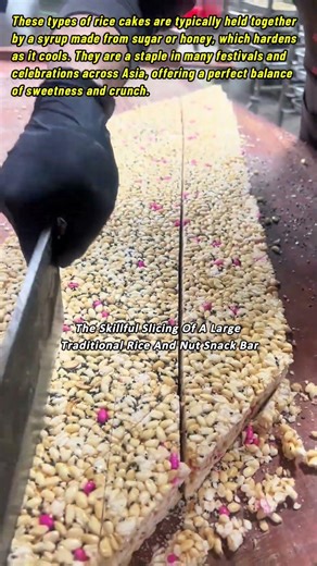 The Skillful Slicing Of A Large Traditional Rice And Nut Snack Bar