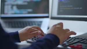 clip-1089782569-closeup-hand-developer-programmer-soffware-engineer-support