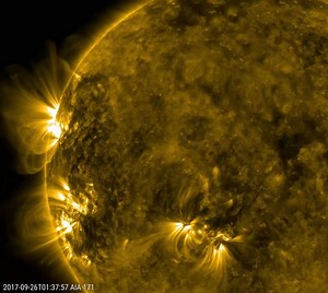 Three distinct solar active regions with towering arches rotated into view over a three-day period from Sept. 24-26, 2017. Charged particles spinning along the ever-changing magnetic field lines above the active regions trace out the magnetic field in extreme ultraviolet light, captured here by NASA’s Solar Dynamics Observatory. Extreme ultraviolet light is typically invisible to our eyes, but is colorized here in gold. To give some sense of scale, the largest arches are many times the size of E