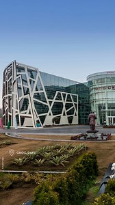 ONGC Delhi – Designed by Architect Hafeez Contractor, this green headquarters is a benchmark in sustainable institutional architecture. The building orientation is optimized for minimal solar heat gain, supported by passive design strategies that promote thermal comfort and energy efficiency. The façade employs high-performance double-glazed units with external shading devices—including vertical fins and horizontal louvers—that reduce glare and control heat ingress. Materials used include recycl