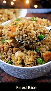 Fried Rice Ingredients 3 cups cooked, chilled rice 2 tbsp oil (vegetable or sesame) 2 eggs, beaten 1 cup mixed veggies (peas, carrots, corn) 3 green onions, sliced 2–3 tbsp soy sauce 1 tbsp oyster sauce (optional but delicious) 1 tsp garlic, minced 1 tsp ginger, minced Salt & pepper to taste Optional protein: diced chicken, shrimp, ham, or bacon Instructions 1. Scramble the Eggs Heat 1 tbsp oil in a large skillet or wok. Add beaten eggs and scramble until set. Remove and set aside. 2. Cook the V