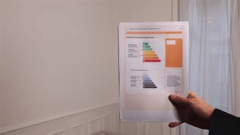 clip-4000244633-person-consulting-energy-performance-diagnosis-dpe-file