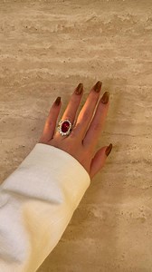 Some rings are beautiful. This one is truly one of a kind and impossible to forget.❤️‍🔥 Featuring The Gloria, 8CT Elongated Oval-Cut Ruby Halo Cathedral Ring paired with The Isabella, Double-Row V-Shaped Diamond Band oval ruby engagement ring // ruby ring // ruby halo engagement ring // diamond v shaped band // ruby and diamond ring // luxury ruby ring // custom engagement ring // fine jewelry Beverly Hills // Earthena Jewelry #earthena #earthenajewelry #engagementring #ruby #rubyring | Earthen