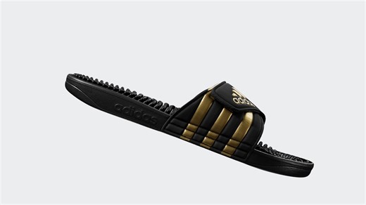 These adidas Adissage slides have a flexible nubby footbed that massages hardworking feet and a bandage upper that adjusts for a custom fit. | Nutmeg Ltd