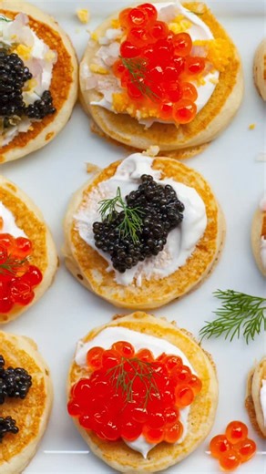Every New Year's Eve celebration needs some caviar!! These easy blini topped with caviar and all the fixings is my favorite treat! You can make the mini pancakes ahead of time, then warm them up when serving. I order my sturgeon caviar online with overnight delivery! Ingredients: For Blini Recipe: 1 1/2 cups buttermilk 1 large egg 2 tbsp butter, melted 1 1/3 cups all-purpose flour 1 tsp baking soda 1 tsp baking powder 1/4 tsp sea salt cooking spray or oil, for frying; as needed For Toppings: 2 o
