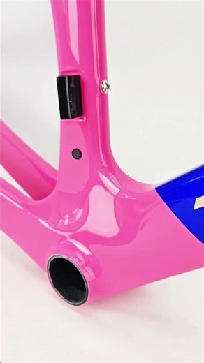 The A9 road bike frame features a high-saturation pink and blue livery.#icancycling #a9