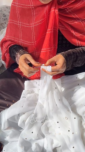 ShaSumz Karigar hand embroidering fabric with Mukaish work using her nimble fingers Mukaish / Baadla is a metal embroidery, where you take little strands of metal and twist them into patterns and little dots with your hand-either to adorn chikankari outfits, or to form complete motifs and textiles of the mukaish jaal. The base fabrics can range from soft georgettes and chiffons to sturdy raw silks. #karigars #shasumzkarigars #karigarsofindia #mukaish #mukaishwork #kamdani #kamdaniwork #indianhan