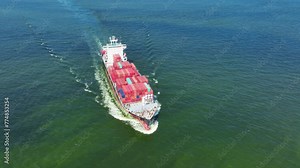 Side view Cargo Container ship the ocean ship carrying container and running for import export concept technology freight shipping by ship