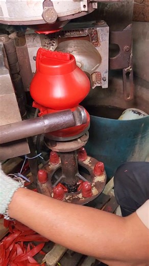 A man is making a lota using a special machine.
