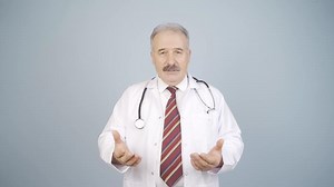 The doctor looks at the camera and gives advice.