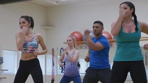 Download Group of people doing exercise class at gym for free