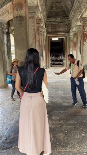 Guide explain compass in the middle of Angkor wat temple