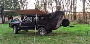Hero Saves Official Pontiac Aztek Tent From Junkyard, Installs It On His Jeep Cherokee XJ - Jalopnik