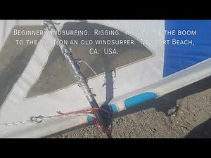 How to rig an old windsurfing board: Tie the boom to the mast.