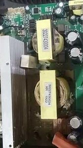 The image displays the internal printed circuit board (PCB) of an electronic power device, commonly