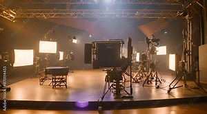 Empty Television Studio Set Illuminated by Lighting Rigs