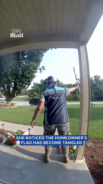 Delivery driver stops to fix American flag