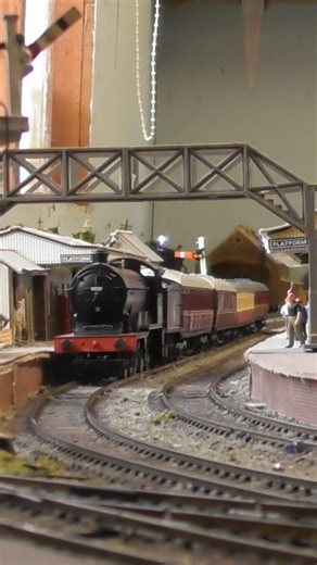 Ex-GER/LNER B12 4-6-0 running through the station with the express passenger service.