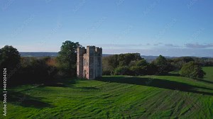 The Belvedere Tower over Powderham Park from a drone in Autumn Colors, Powderham Castle, Exeter, Devon, England