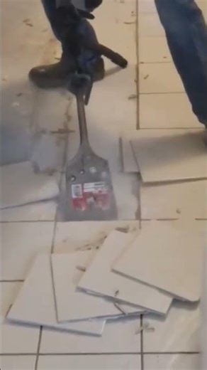 Milwaukee cordless SDS max m18 chipping hammer removing ceramic tile on the Florida coast