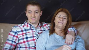 Man and woman fight for the TV remote. 1920X1080 Full Hd.