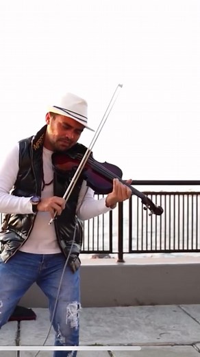 Emotional Outdoor Violin Performance at Sunset