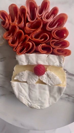 Santa Brie 🎅 This charming idea from @makefoodlovely transforms any cheese board into a festive, seasonal moment. Shop cheese boards and accessories at the link here: https://bit.ly/3LDKmLe. | Williams Sonoma