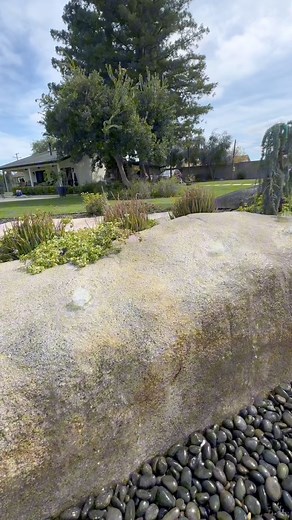 Converting granite outcropping into a water feature. These clients had some large granite outcroppings and they asked me to convert it into a water feature. At first my plan was to core drill some holes for the plumbing, but due to site logistics, and locations of where I needed the holes, that route was going to be too challenging. I ened up cutting a trench in the outcrops and had my buddy Roca Concrete fill in the trenches with decorative concrete, then stained and textured it to match. This 