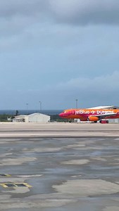 A sweet surprise landed today! 🍩✈️JetBlue’s A320 aircraft named Brewing Altitude touched down at Aruba Airport, featuring Dunkin’s signature bright pink and vibrant orange colors. 💗🧡 #aua #arubaairport #aruba #onehappyisland | Queen Beatrix International Airport