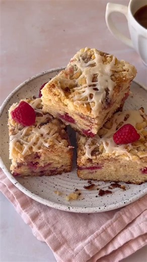 Sweet, tart raspberries folded into a tender cake base with a buttery...