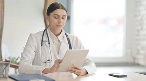 Young Female Doctor Using Tablet Clinic Stock Footage Video (100% Royalty-free) 1101893937 | Shutterstock