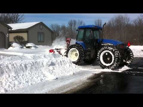 Bi directional New Holland tractor with Pronovost PXPL snow blower