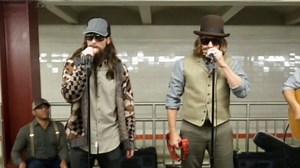 Disguised celebrities perform in subway