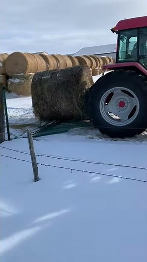 A Tractor Uses the Lakeland Push n' Drive Over Gate
