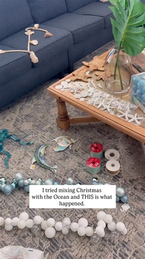 Luxury Beach House Rental 📍 Emerald Isle, NC on Instagram: "Under-the-sea… but make it Christmas. Watch our beach house tree glow up from simple to SEA-sonally magical with coastal colors, ocean-kissed details, and a little mermaid shimmer. ✨🌊🎄 I took the viral Christmas Ball Garland trend and turned it into a wave cascading down the tree - complete with a few ocean-friendly creatures riding along. Did you spot the little fish peaking out? #beach #christmastree #beachhouse #emeraldisle #there