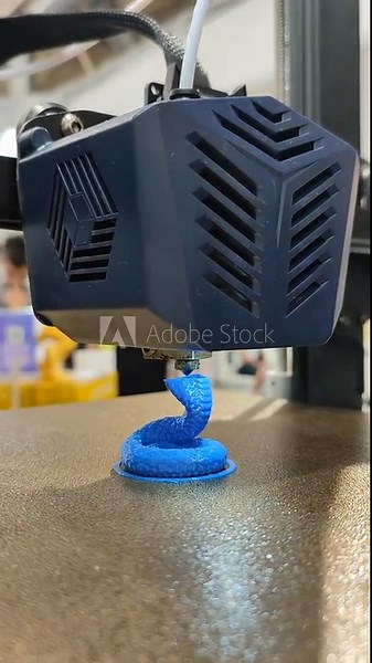 Process of printing object on 3D printer from molten plastic. 3D printer printing model using plastic from extruder. 3D printing technology. New modern additive prototyping technologies. Vertical