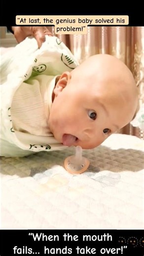 “Hahaha, the mouth couldn’t reach the pacifier, so quickly used the hand to grab it.” 😆#genius baby