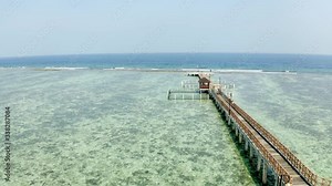 walkway over the ocean above clear water in Pramuka Island of Thousand Islands of Jakarta Indonesia