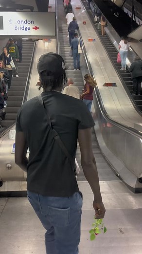 Person Gifts Roses in London Bridge Subway Station