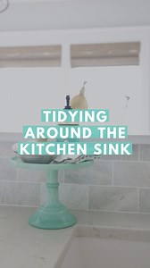 3.8K views · 25 reactions | I’ve been using a cake stand to organize our kitchen sink items for more than a decade now, and I still love it! 殺 It looks pretty and keeps us from accumulating a bunch of messy clutter since the surface area is limited. Win-win!  | Abby Lawson - Organizing, Decorating, Blogging | Facebook