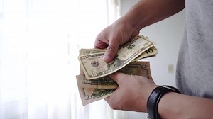 Hands counting money in cash | Premium Stock Video Footage