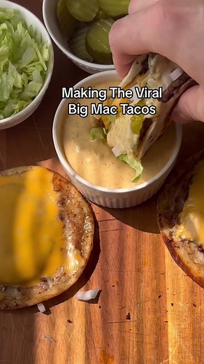 Full recipe for these viral Big Mac tacos below. 1. Place about 2oz of ground beef on street taco tortillas. 2. To a pan add in neutral oil and cook your meat fully before flipping over. 3. Flip over and add in American cheese and cover with lid for about 1 minute. 4. Add in your shredded lettuce, diced onions, pickles and “Big Mac” sauce. Sauce recipe: 1 cup Mayo ¼ cup Relish 1 tablespoon of Yellow Mustard 1 teaspoon White Vinegar 1 teaspoon Paprika ¼ teaspoon Garlic Powder Half a teaspoon of s