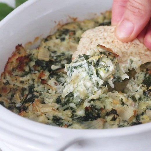 2.3M views · 1.5K reactions | Hot and Cheesy Spinach Artichoke Dip, perfect for game day apps! Serve with chips or mini bell peppers to keep it low-carb. 2 Freestyle Points • 73 Calories (1/4 cup) https://www.skinnytaste.com/hot-spinach-and-artichoke-dip/ | Skinnytaste | Facebook