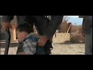 Terminator picks up and examines a toddler