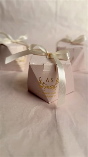 Pockets of Beige on Instagram: "You won’t stand out, they said! Fit more of those yummy treats in the polygonal shaped bidh box with names and other details beautifully foiled on it. Finished with a nice bow to complete the look."