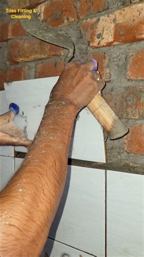 I installed white tiles in the middle of the bathroom wall.#walltiles #whitetiles #tilesfitting