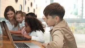 Boy raised hand while multicultural friend learning prompt at STEM technology class. Diverse student study about engineering code and programing system. Answer question. asking, voting. Erudition. Stock Video