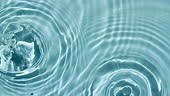 Top view slow motion of drop falls into water and diverging circles...