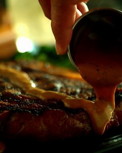 Slow down and let the good stuff catch up. 😋🥩 Comment below which seasonal sauce you'd pour on your Bone-in Ribeye: A. Roasted garlic butter B. Savory peppercorn sauce C. Spicy Fresno chili jam | Outback Steakhouse - National