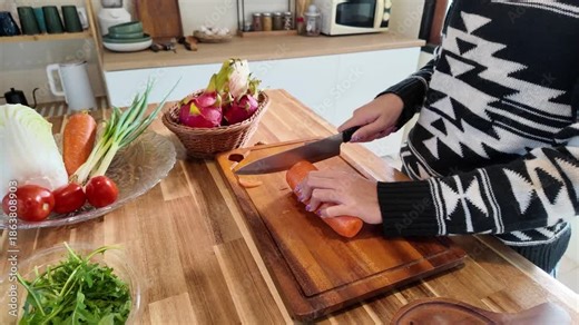Woman in the kitchen preparing homemade food, female hands working with fresh vegetables